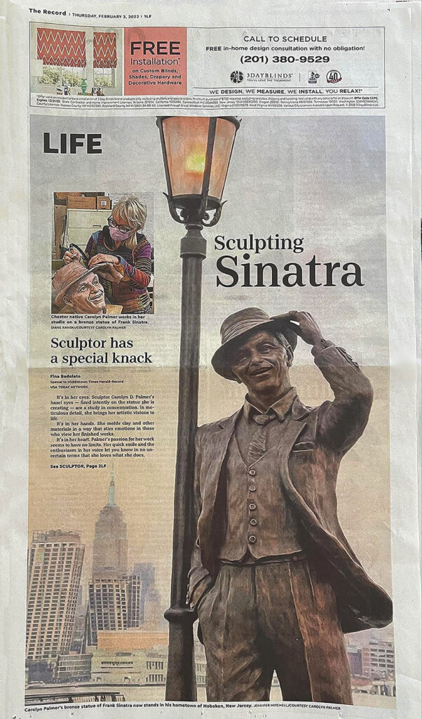 Newspaper front-page feature highlighting the Frank Sinatra bronze statue, shown beneath a lamppost with a city skyline in the background.