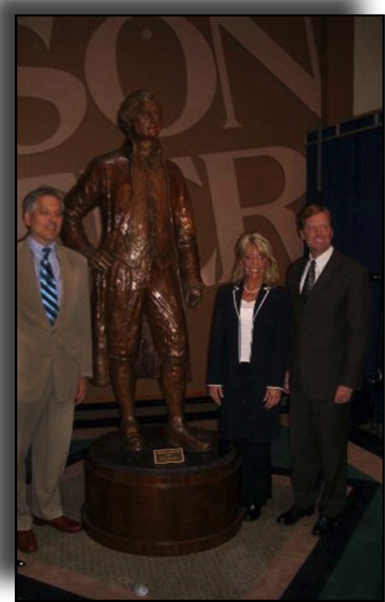 Sculptor Carolyn D. Palmer standing with Mayor Matt Driscoll beside the bronze Thomas Jefferson statue at an unveiling event.