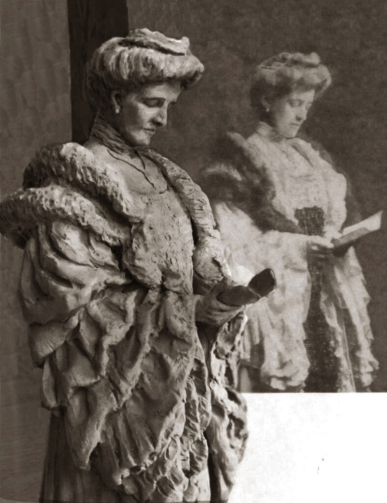 Sculpted figure of Edith Wharton shown in the foreground, positioned beside a historical reference photograph of Wharton displayed in the background.