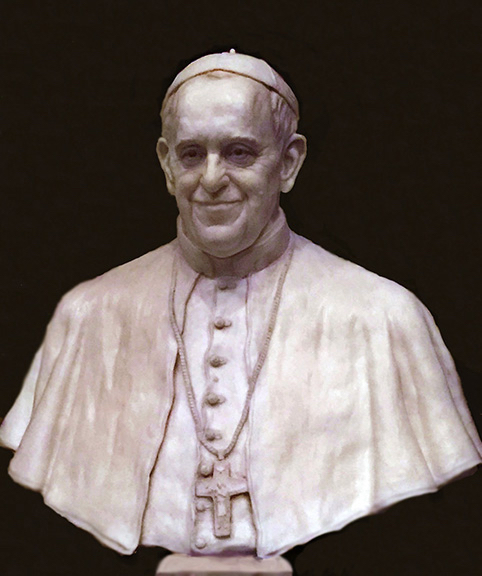 Finished white sculptural bust of Pope Francis wearing clerical garments and a pectoral cross.
